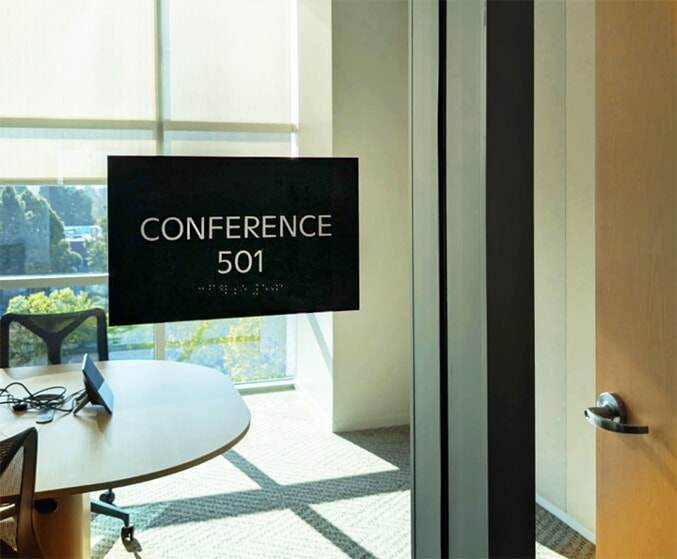 ADA Conference room sign with braille